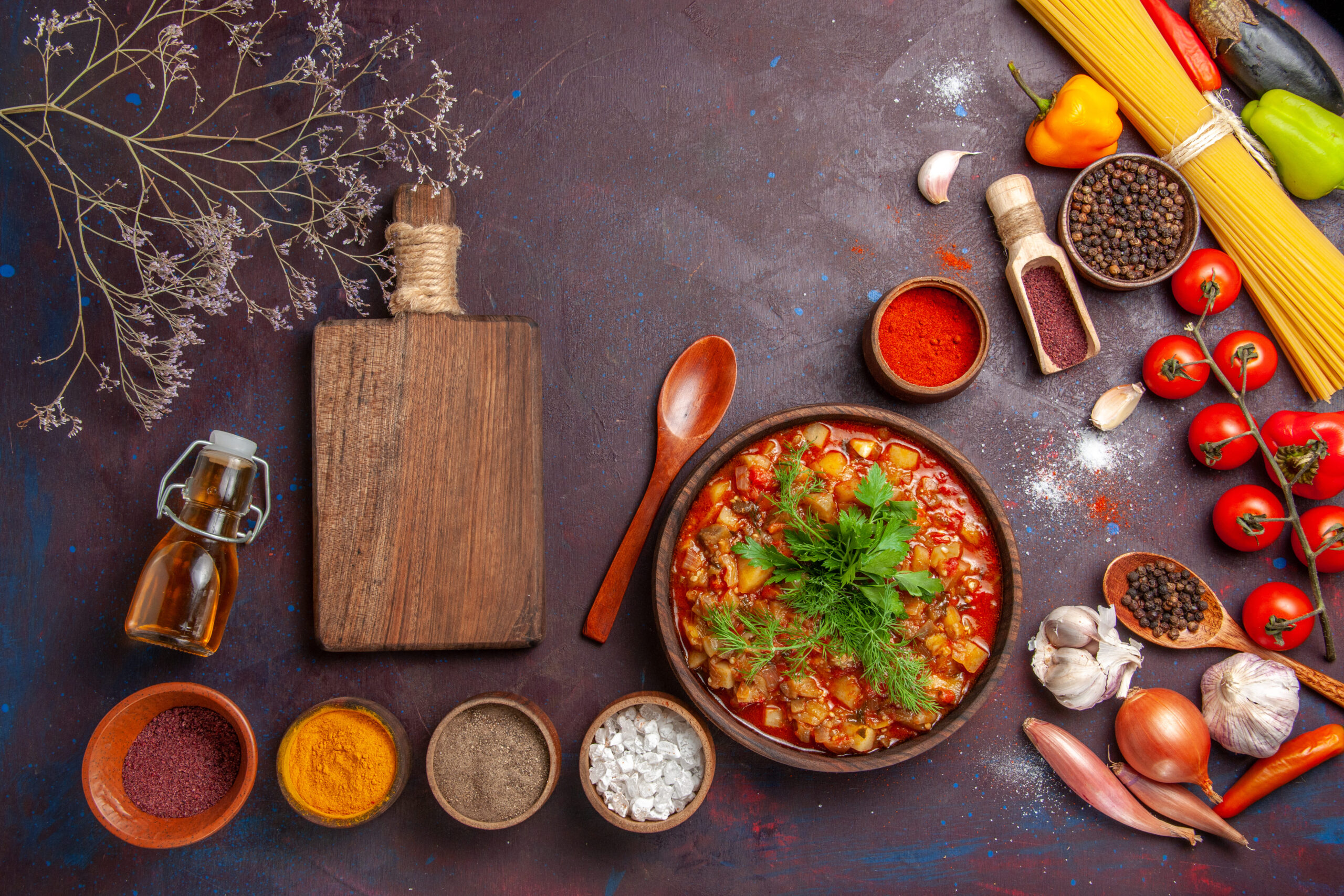top-view-delicious-cooked-vegetables-sliced-with-different-seasonings-dark-background-soup-food-sauce-meal-vegetable (1)